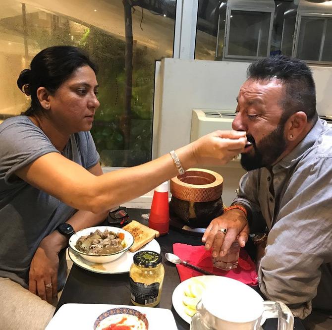 In picture: Priya Dutt is seen feeding her brother Sanjay Dutt as the siblings bond over dinner.