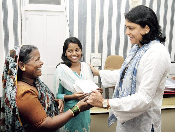 After she won the Lok Sabha seat from Mumbai North constituency in 2005, Priya Dutt was appointed as the secretary of the All-India Congress Committee.
In picture: Priya Dutt greets Savita, an MBA aspirant, and her mother as she donates Rs 25,000 for her last semester's fees.