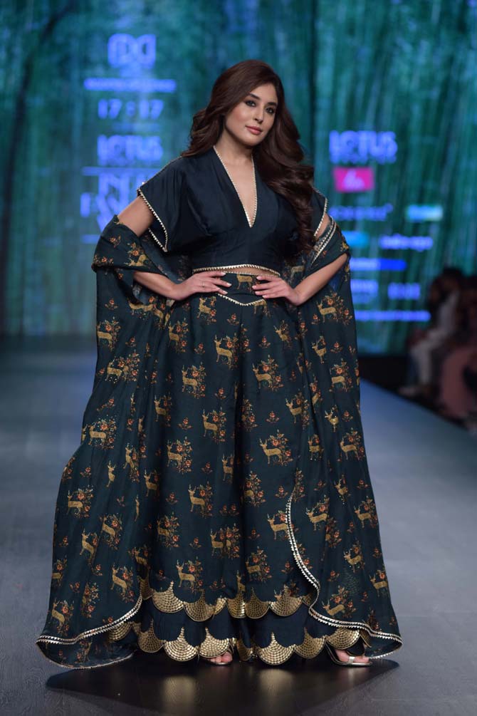 Kritika Kamra looked pretty floral black dress to walk the ramp. 