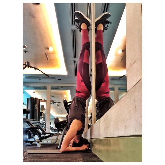Former Miss World Manushi Chhillar is seen perfecting the head-stand as she sets the gym on fire with her near-perfect physique and toned body.