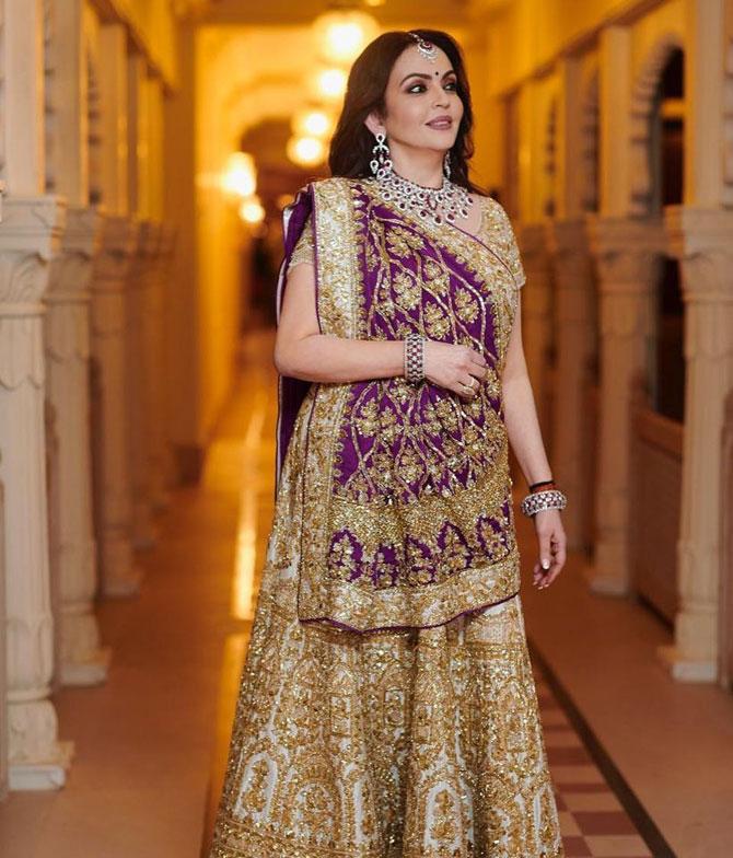 Nita Ambani turned a lot of heads at Isha Ambani's wedding. This is one of her most stylish ethnic looks and she sets some serious ethnic goals for women. She went for a heavy golden lehenga and paired it with a purple dupatta, creating a beautiful contrast