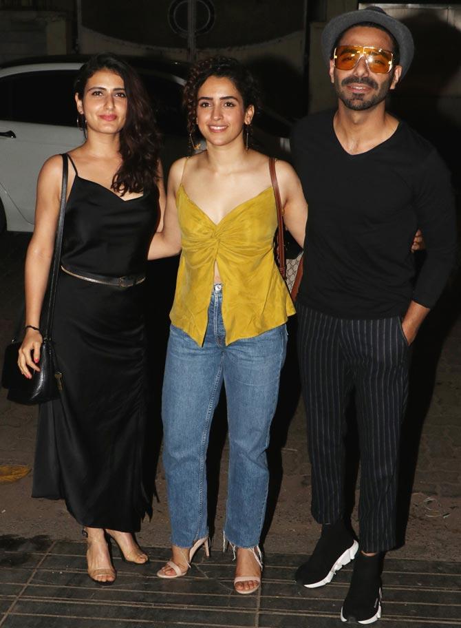 Dangal team - Fatima Sana Shaikh, Sanya Malhotra and Aparshakti Khurana attended a dinner celebration hosted for Guneet Monga at a popular restaurant in Khar, Mumbai. While Fatima looked pretty in her black satin dress, Sanya sported a mustard coloured camisole top for the outing. All pictures/Yogen Shah