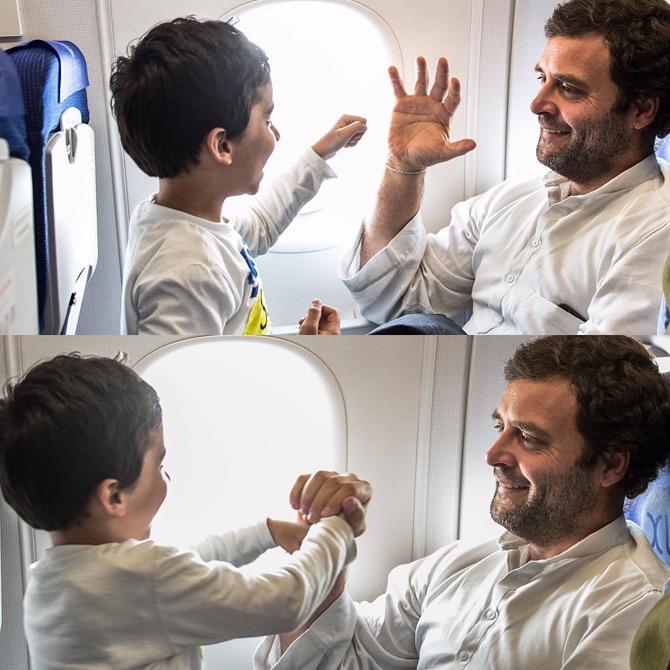 Congress president Rahul Gandhi is truly a people's leader and just like his great grandfather Jawaharlal Nehru, he is too fond of children. His cute and candid photos with children are proof enough!
In pic: Rahul Gandhi plays with a small child during his flight amidst travel.