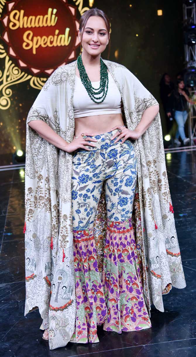 Sonakshi Sinha sported Indo-western outfit for the promotional event. Her sharara set with a white crop top and a jacket stood out when she attended the sets of the reality show. 