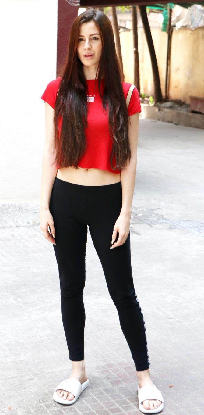 Giorgia Andriani was also spotted post her workout session at her gym in Bandra. Giorgia kept it simple in a red tee and gym pants.