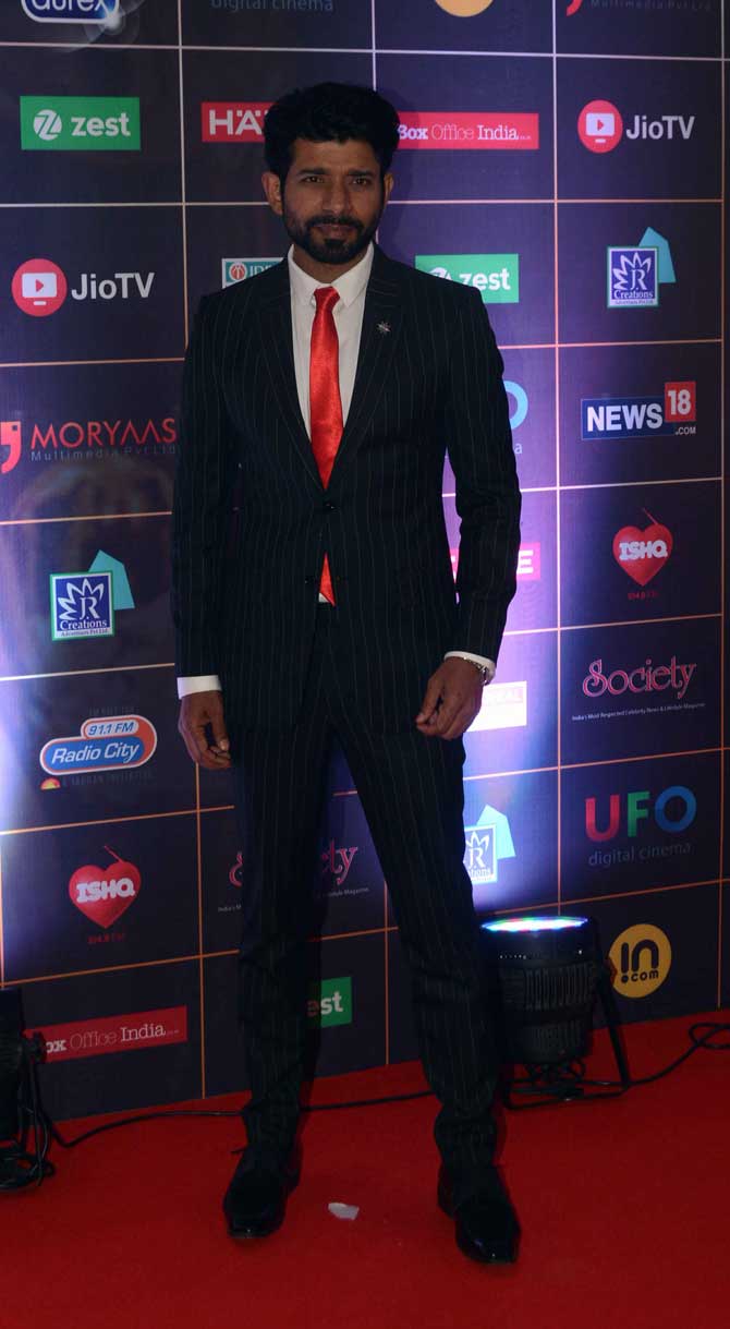 Vineet Kumar Singh, who was last seen in Akshay Kumar-starrer Gold, opted for a striped black suit to walk the red carpet. 