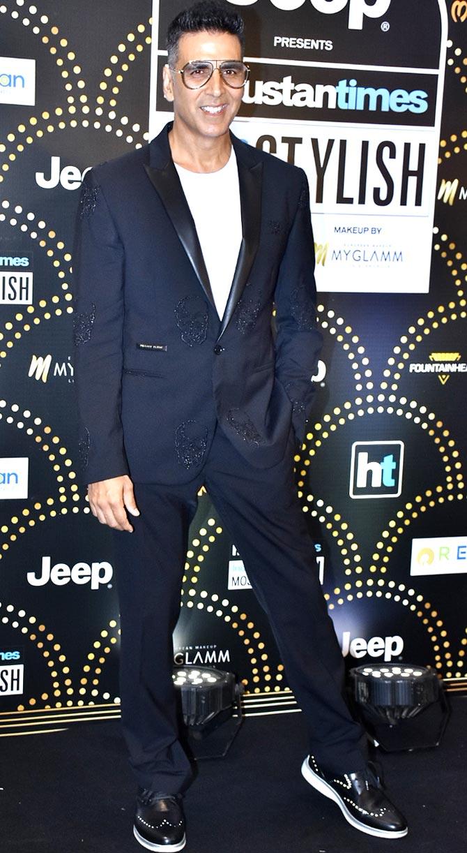 Akshay Kumar looked dapper in his black embroidered suit he opted for the night of fashion. The actor completed his look with black sneakers and retro glasses when snapped by the paparazzi. 