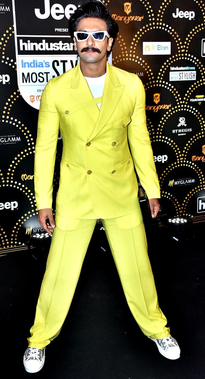 Ranveer Singh walked into the award night with a yellow suit, paired with retro white glairs and converse to attend the fashion gala held at a plush hotel in Lower Parel, Mumbai. 