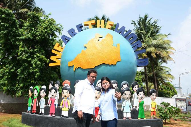 In picture: Ashish Shelar poses for a selfie with MP Poonam Mahajan amidst the art installation of 'We Are The World' in Bandra.