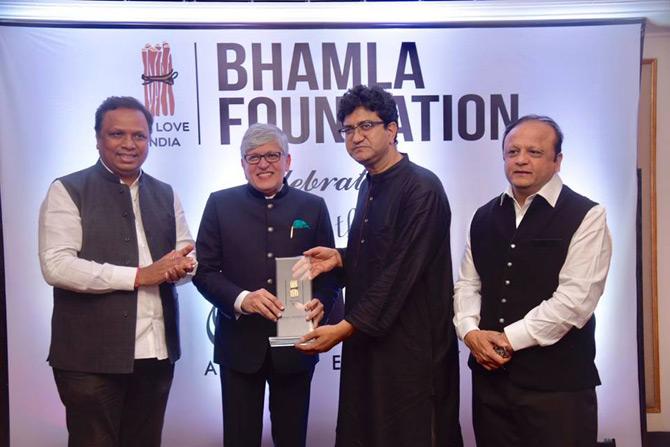 In picture: Ashish Shelar with Asif Bhamla as the two present an award to Prasoon Joshi at the Bhamla Foundation awards ceremony.