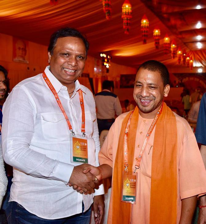 Ashish Shelar shares a laugh with Uttar Pradesh Chief Minister Yogi Adityanath at the BJP convention.