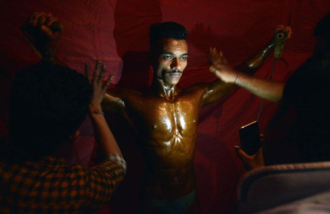 A bodybuilder displays his muscles during the Mumbai Bodybuilding competition 'Mumbai Shree 2019', organised by Maharashtra Navnirman Sena (MNS) at Vithaldas Nagar, Khar in Mumbai on Sunday.