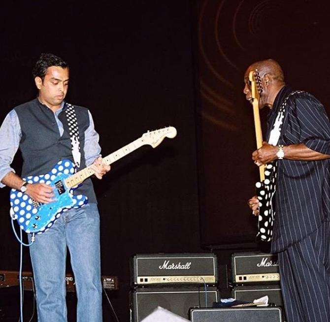 Did you know that Milind Deora is also a blues guitarist and has several performances to his credit? He held the guitar for the first time at the age of seven and since then playing the six-string has been his passion. Till date, he has collaborated with various artists such as blues legend Buddy Guy, Sharon Prabhakar to name a few.
In photo: Milind Deora with blues legend Buddy Guy