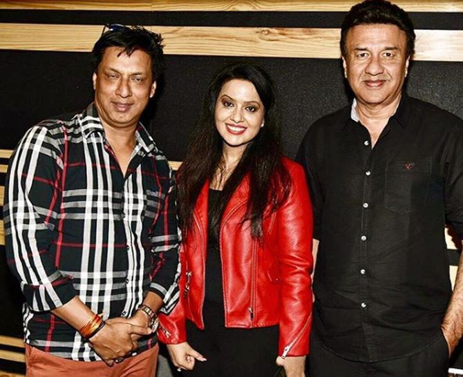 For an event in Mumbai, Amruta Fadnavis was seen donning a red leather jacket which she paired with black jeans. Amruta left her hair open which gave her a natural look.
In pic: Amruta poses with Bollywood director Madhur Bhandarkar and musician Anu Malik.