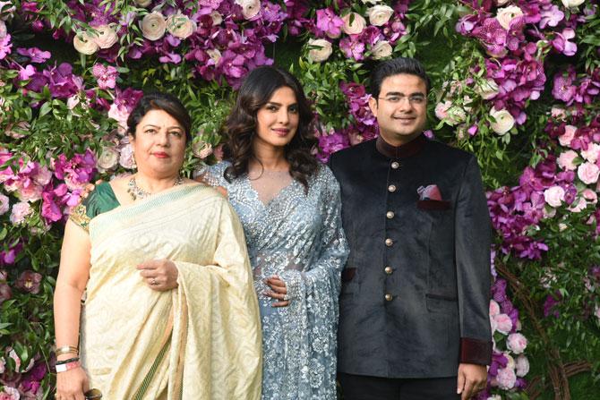 Priyanka Chopra with mother Madhu Chopra and brother Siddharth Chopra attended the grand wedding of industrialist Mukesh Ambani's son Akash Ambani with Shloka Mehta. Priyanka Chopra looked stunning in a beautiful powder blue sari