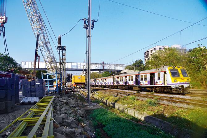 The work of laying girder over railway tracks has been tough since it requires stopping all trains on the route
