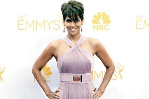 Halle Berry goes topless to show off tattoo