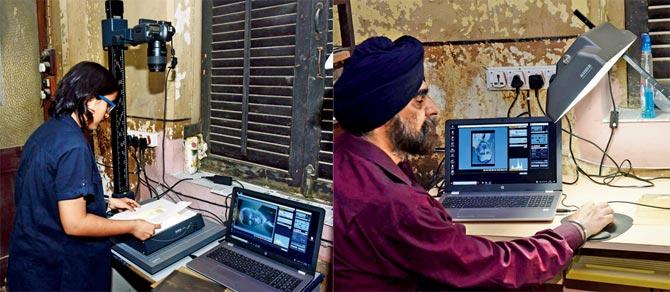 Soumya Gupta places the negative on the copy stand; Gurjeet Singh positions and shoots the image on the software that facilitates a direct transfer