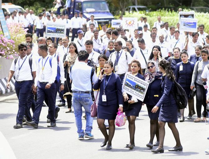 On May 1, 2019, the Delhi High Court issued a notice to Jet Airways on a plea seeking prompt redressal of consumer complaints in the wake of the ongoing crisis.
In pic: Jet Airways employees carry a placard stating, 'Save Jet Airways, Save Our Future'!