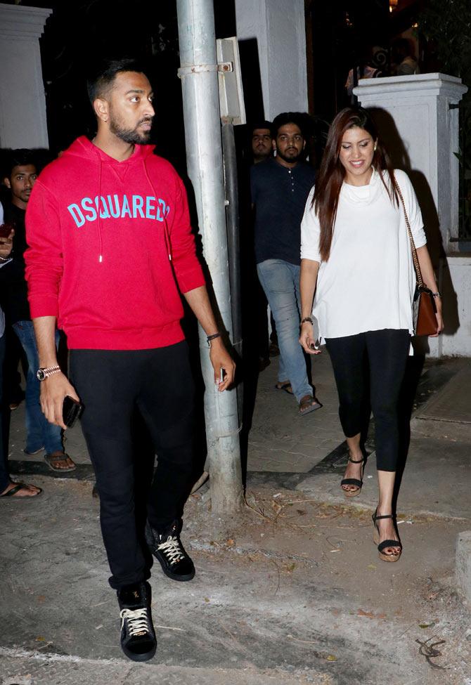 Krunal Pandya was looking smart in a red hoodie and black pants, he teamed it up with a pair of black shoes. Pankhuri Pandya was wearing a white top and black pants.