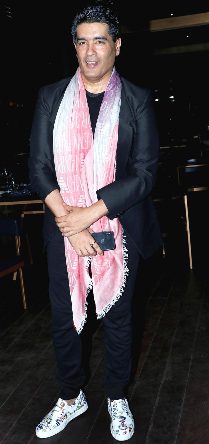 Designer Manish Malhotra arrives for Freddy Daruwala's birthday bash at a popular eatery in Mumbai.
