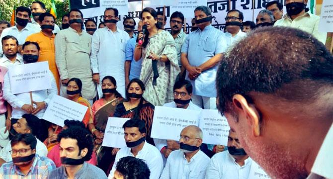 Protestors in Mumbai's Nariman Point were seen with black gags on their mouth while others raised slogans against the Mamata Banerjee government and its 