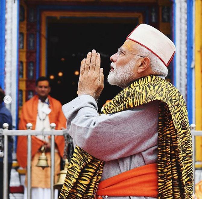 Narendra Modi also waved to the pilgrims who gathered around the Badrinath temple situated at a height of 10,170 feet in the Garhwal Himalayas. Earlier, after spending Saturday night meditating inside a cave, Modi offered prayers at Kedarnath temple in the morning