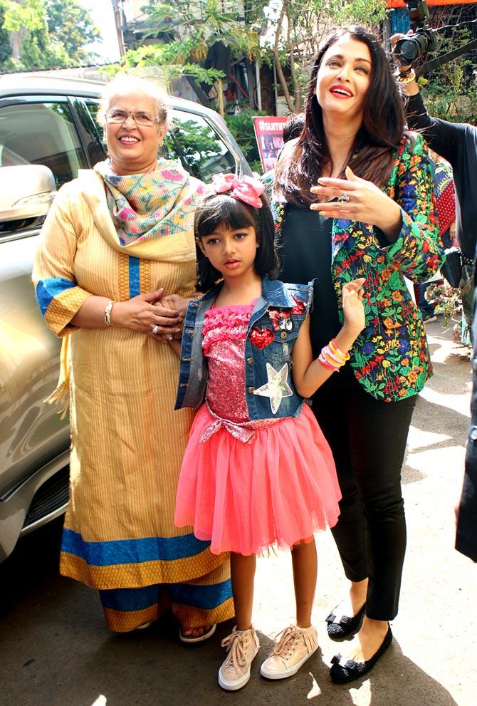 Aishwarya Rai Bachchan looked gorgeous as she was wearing Barbara Bui's multi-hued jacket. She paired it with black skinny jeans. 
Pictured: Aish with her mother Vrinda Rai and daughter Aaradhya.
