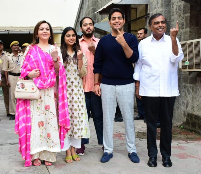 In pic: With a huge smile on her face, Isha Ambani poses for the paparazzi along with her family after exercising her right to vote during the Lok Sabha elections in Mumbai.