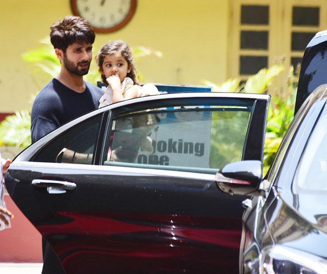 Cutie Misha Kapoor was spotted with dad Shahid on his way to the gym. The toddler was nestled safely in dad's arms when they were clicked by the paps in Bandra. All pictures/Yogen Shah