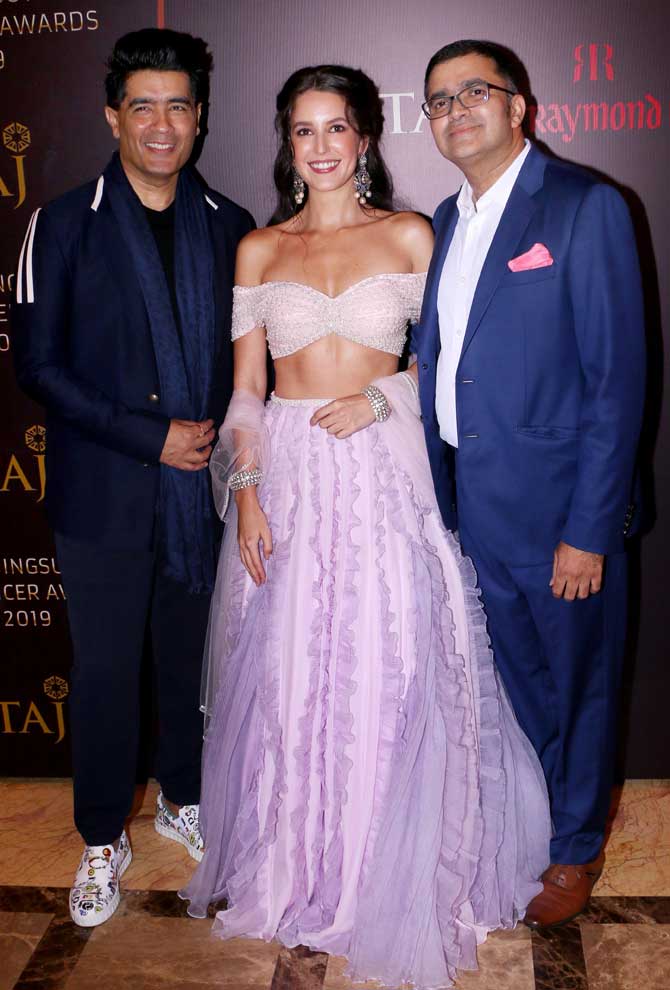 Designer Manish Malhotra, Isabelle Kaif poses for the photographers at the award gala at a plush hotel in Bandra.