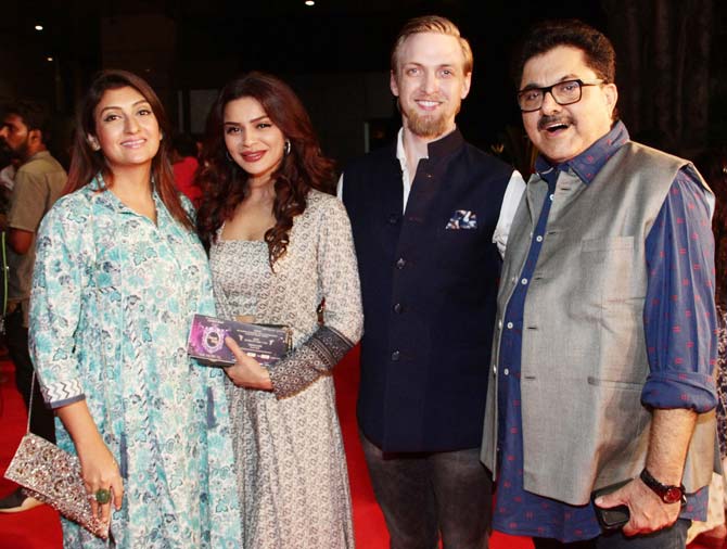 Juhi Parmar, Aashka Goradia, Brent Goble and Ashoke Pandit posed together for the shutterbugs at the premiere of the music theatre 'Umrao Jaan', held at Rangmandir, Bandra.