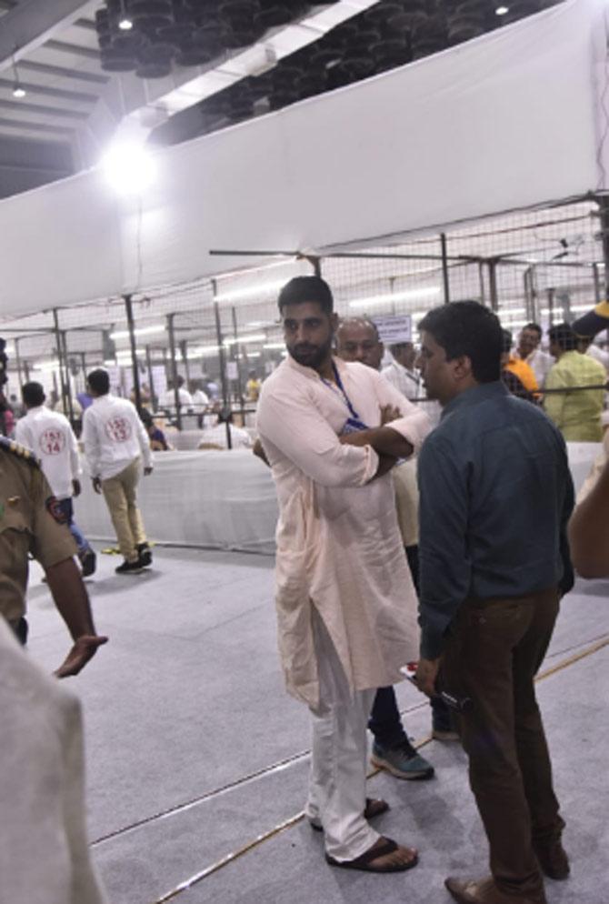 Urmila Matondkar's husband Mohsin Mir looks on as counting continues in Mumbai North.