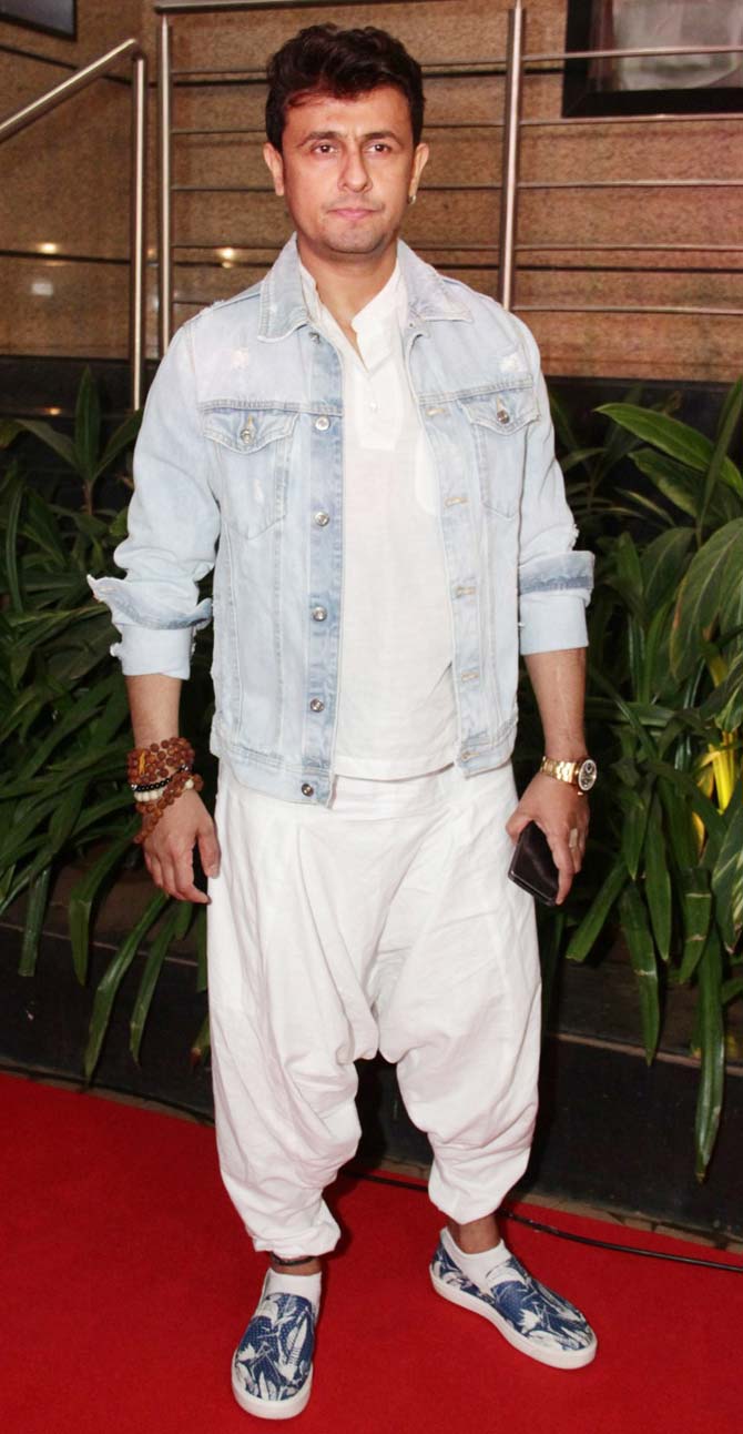 Sonu Nigam opted for white dhoti pants, t-shirt, paired with a denim jacket for the premiere of the music theatre 'Umrao Jaan', held at Rangmandir, Bandra.
