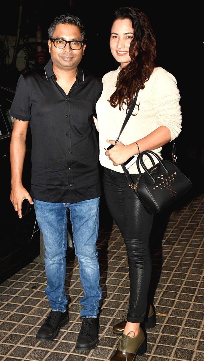 Director Raj Kumar Gupta and wife Myra Karn were all smile as they posed for the photographers at India's Most Wanted screening in Andheri.