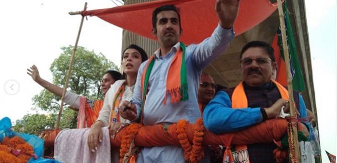 In pic: Gautam Gambhir with his wife Natasha Jain during a rally