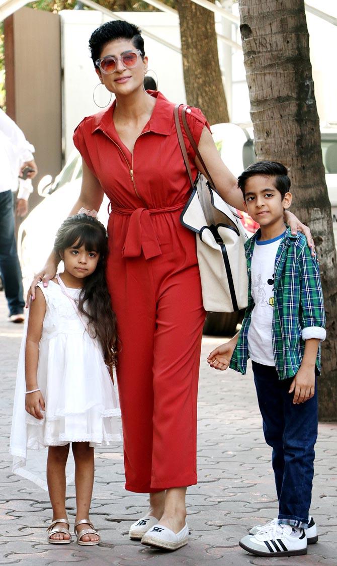 Ayushmann Khurrana's wife Tahira Kashyap was clicked with her children - Virajveer and Varushka. While Tahira opted for a red jumpsuit for the party, Varushka looked pretty in a white frock and Virajveer donned white t-shirt, paired with checkered shirt and jeans - much like his father!