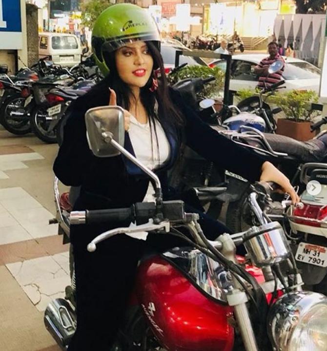 Revealing her adventurous side, Amruta Fadnavis is often seen donning her biking gear. Amruta Fadnavis shared this picture posing on a red motorcycle on the eve of Women's Day in order to express her views on woman power and everything that a woman can do.