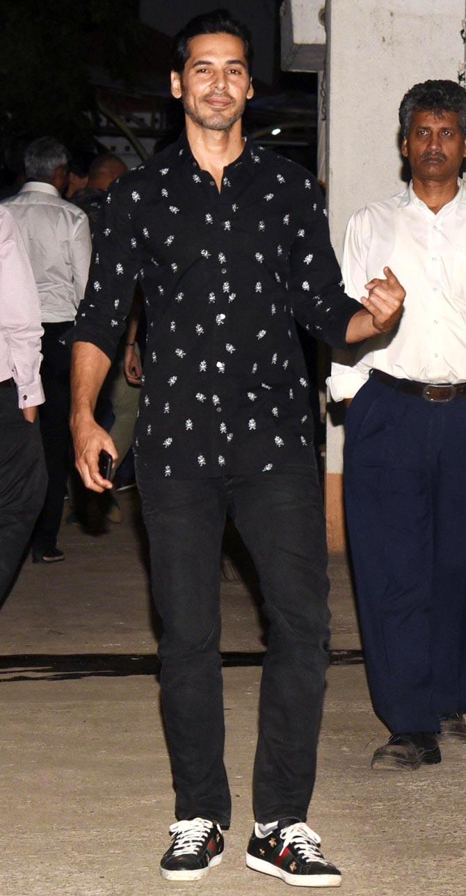 Dino Morea opted for a black printed shirt, which he paired with black pants and sneakers to attend the celebration. 