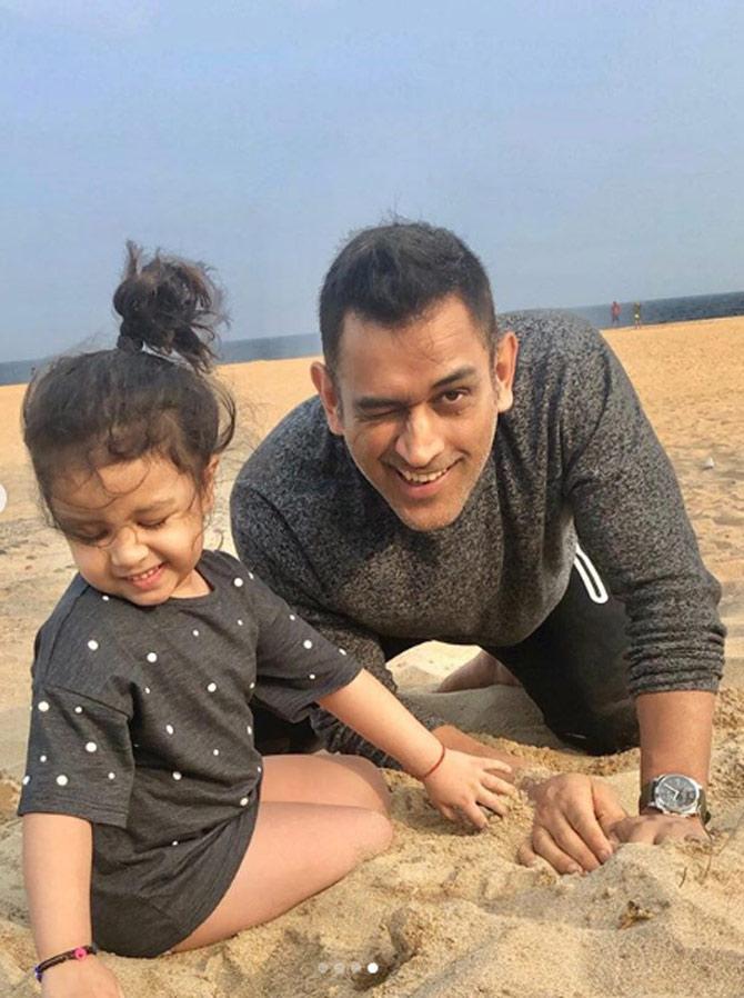 In this picture, MS Dhoni lends a helping hand in building Ziva Dhoni's sand castle, as the little princess takes a break.