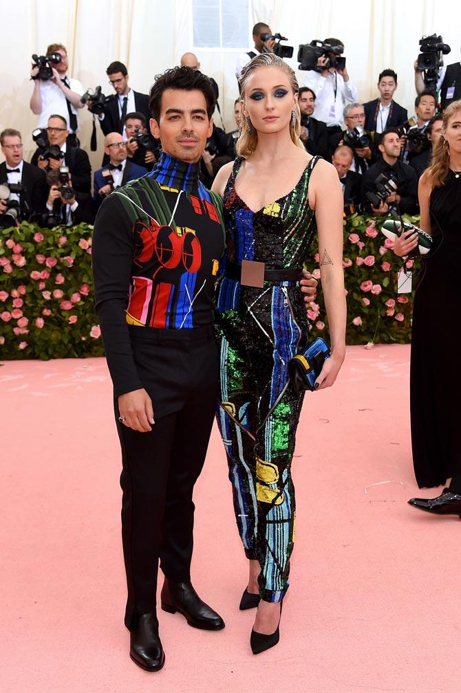 Five days after tying the knot, Sophie Turner and Joe Jonas made their first red carpet appearance as a married couple at the 2019 Met Gala. For the star-studded 'Camp: Notes on Fashion' themed event, Sophie wore a sequinned custom Louis Vuitton two piece that looked like a jumpsuit, reported People. While Joe colour coordinated with his beloved wife in a black ensemble that featured multi-coloured details.