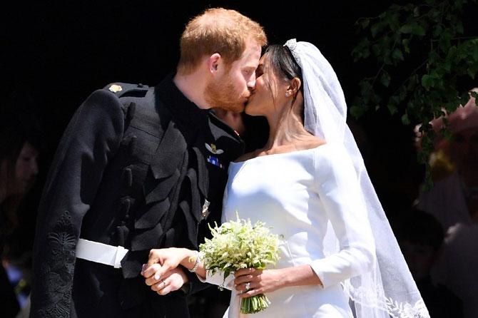 Meghan Markle looked beautiful in pure white silk Givenchy gown and 15 feet veil embroidered with flowers and held in place by a diamond tiara lent by the Queen for her wedding with Prince Harry. Meghan surprised everyone by wearing a wedding dress designed by Givenchy's Clare Waight Keller after months of speculation linking her to other designers such as Erdem, and moved her groom to tears in the stunning classic creation