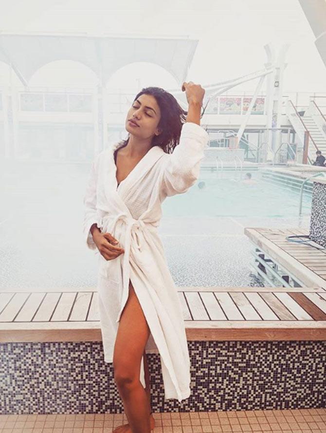 Urvi Shetty looks all dreamy as she poses in a white bathrobe. She captioned the photo, 