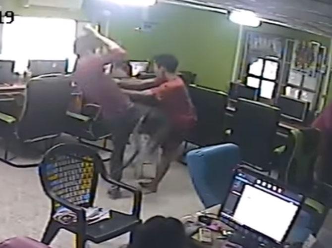 Man panics as snake attacks his butt:
On April 13, 2017, In a rather scary incident that was caught on CCTV, a snake tried to bite a man near the door of an Internet cafe in Thailand. In the video that had taken the internet by storm, the man is seen walking towards the door when a snake comes out of nowhere and grabs his backside. The man panics and runs hither-tither even falling oddly in the melee. Later, the man and his friends tried to figure out where the snake went which resulted in confusion and chaos among them.
In pic: A screengrab of the video