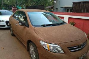 Woman covers car with cow dung to beat the heat; Internet goes crazy