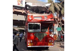 Double decker bus crashes into overhead railing; no casualties reported