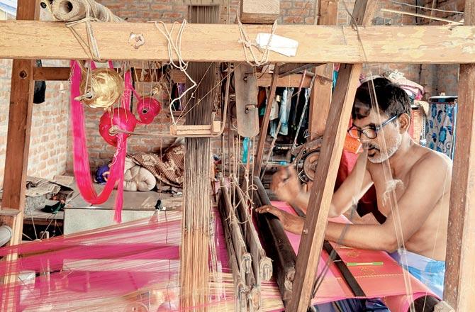 Faizul Hassan, a weaver, earns much less than what his Benarasi sarees sell for