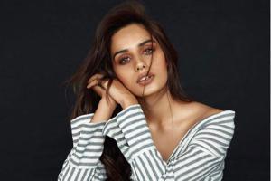 Manushi Chhillar resembles a sultry diva in this off-shoulder shirt
