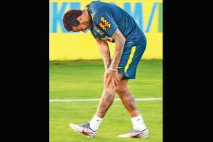Brazil's Neymar misses training after knee pain