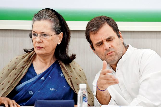 Indian National Congress (INC) president Rahul Gandhi  gestures while talking to Sonia Gandhi during a Congress Working Committee (CWC) meeting in New Delhi on May 25. Pic/AFP